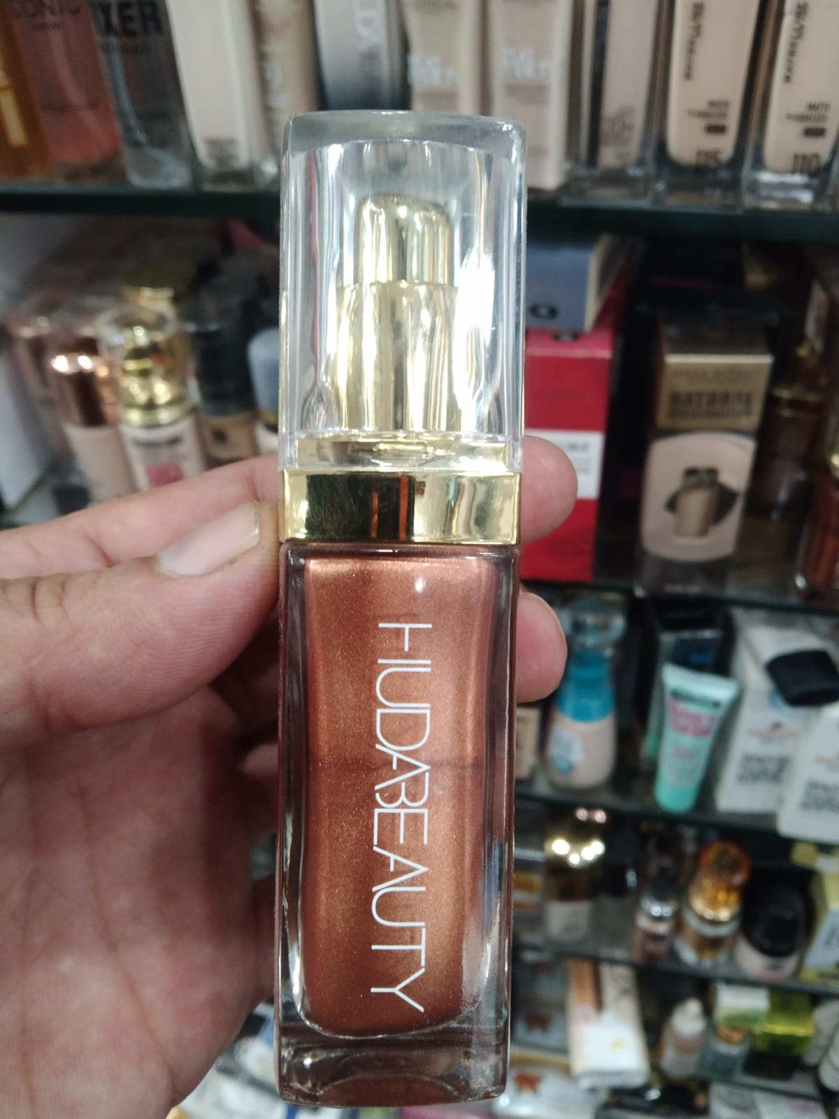 Huda Beauty N.Y.M.P.H. All Over Body Highlighter – Liquid Illuminator for Face, Body & Legs – Water-Based, Long-Lasting Glow – 35 ml - Image 2